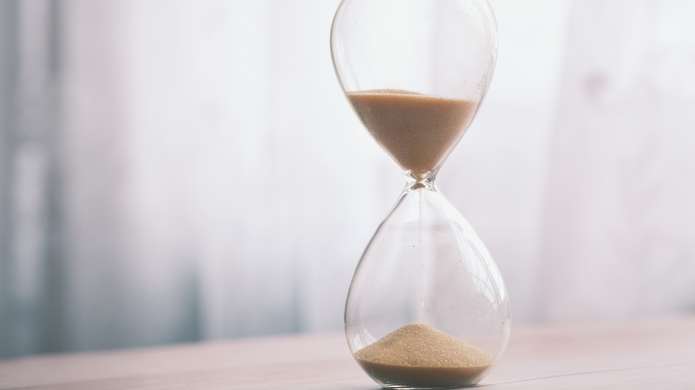 hourglass filling with sand